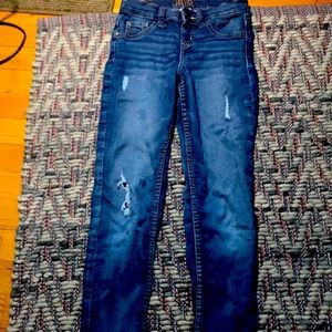 Dark blue jeans with tiny Rips